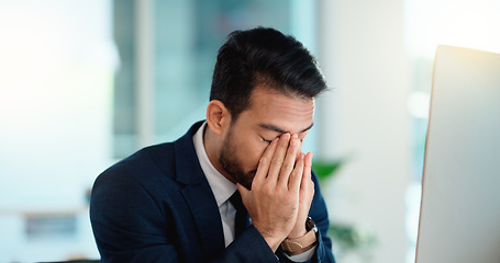 Image showing Stressed web developer suffering with mental block while trying to code on a computer in his office. Frustrated data scientist struggling with fatigue and feeling the pressure to hit his deadline