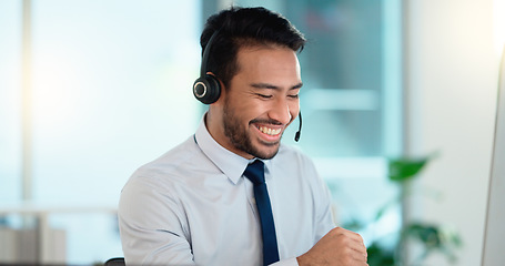 Image showing Call center agent consulting a buyer via video call in an office. A young friendly sales man talking to a client in a virtual meeting. A male customer service employee advising a consumer