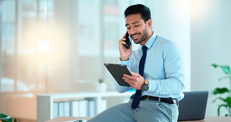 Image showing Business man talking on a phone while browsing on a digital tablet in an office. Dedicated sales executive and young expert communicating project plans and discussing deals with clients in a company