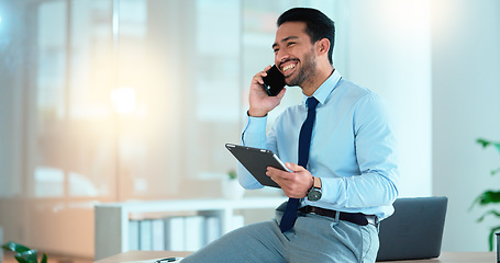 Image showing Business man talking on a phone while browsing on a digital tablet in an office. Dedicated sales executive and young expert communicating project plans and discussing deals with clients in a company