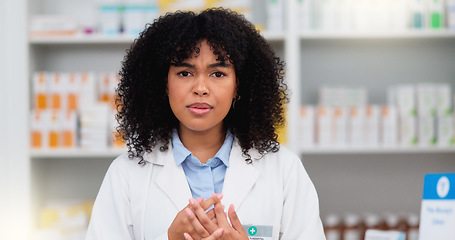 Image showing Friendly female chemist explaining the benefits of medicine. African American woman pharmacist listening to the symptoms of the customer. Health worker recommending a specific product to the client