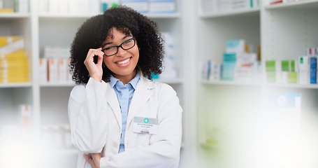 Image showing A friendly female pharmacist with a bright smile is about to help patients at the dispensary. Portrait of happy woman healthcare professional smiling at the pharmacy. A doctor taking off her glasses