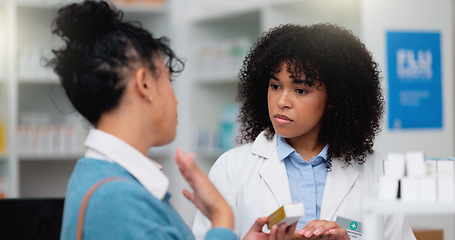 Image showing Happy pharmacy woman consultant helping customer with her prescription. Female pharmacist giving instructions to her client in more detail. Understanding customer listening to professional.