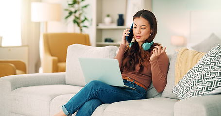 Image showing Girl, phone and call on sofa happy talking, headphones and smile, with laptop for online job in house. Woman, smartphone and conversation on couch, communication and computer for remote work in home