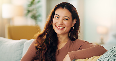 Image showing Serious woman, relax and home with a beautiful asian female feeling calm, peaceful and enjoying her free time on the sofa at home. Portrait and face of a young female sitting in her singapore house