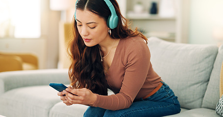 Image showing Woman, phone or music headphones on relax sofa in house or Singaporean home living room. Smile,enjoy or happy student with mobile technology for podcast, dance radio or audio playlist app in lockdown