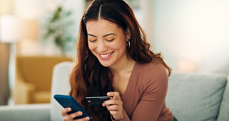 Image showing Woman, phone or credit card for ecommerce, online shopping or bank app in Colombian house living room or home sofa. Smile, happy and relax customer on fintech technology or e commerce retail software