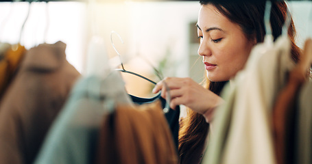 Image showing Fashion, shopping and customer with a woman in a store for retail while looking at clothes to buy or purchase. Buying, consumerism and choice with a female purchaser in a clothing boutique or shop