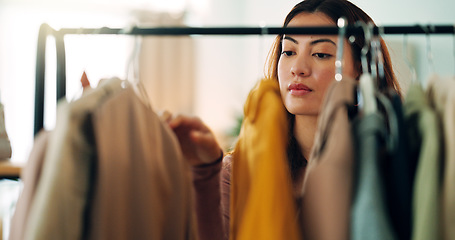 Image showing Retail clothes, happy shopping and woman in luxury designer store for fashion choice on railing in boutique. Rich Asian customer with wealth looking for clothing on discount during sale in mall