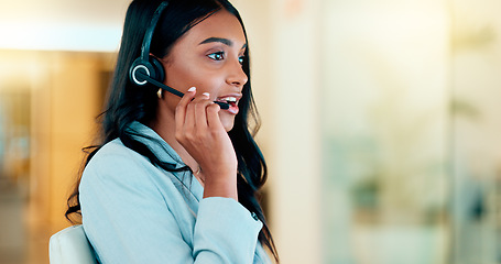 Image showing Professional and helpful call centre woman using a headset, assists business consult. Helpful support service agent talks with client on call. Remote worker gives client advice telephonically