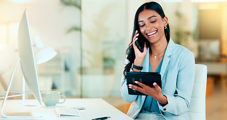 Image showing Happy manager talking on a phone in modern office, booking appointment or arranging a meeting on tablet. Young, carefree professional female talking to a client while responding to emails