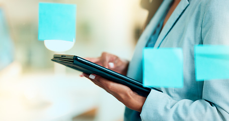 Image showing Advertising agent scrolling for creative ideas online on the internet on a digital tablet while brainstorming alone in an office at work. One marketing worker doing research while planning a project