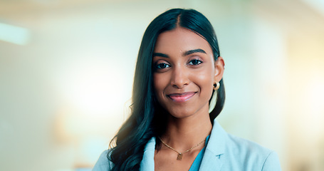 Image showing Satisfied, confident entrepreneur doing an online training for a remote, distance job. Closeup face portrait of a successful business woman standing and smiling against a bokeh, copyspace background.