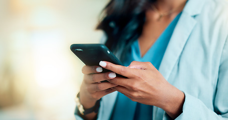 Image showing Closeup of a woman texting, browsing and scrolling on a phone in an office. Hands of a corporate executive, busy entrepreneur and business expert typing a message while networking with clients online