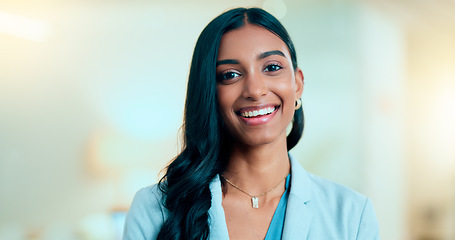 Image showing Satisfied, confident entrepreneur doing an online training for a remote, distance job. Closeup face portrait of a successful business woman standing and smiling against a bokeh, copyspace background.