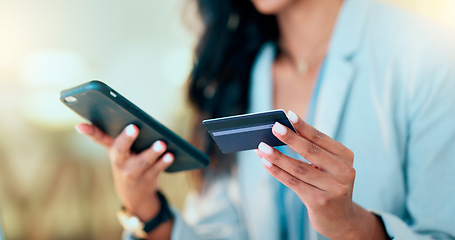 Image showing Bank card data put in phone by a lady who does internet banking by typing on her mobile to make an online credit payment. Young woman texting on her phone to send money via an ewallet transaction