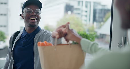 Image showing Delivery, grocery and bag with a black man courier at the front door of a home to drop off produce for a customer. Food, ecommerce and online shopping with a male at a house to deliver fresh goods