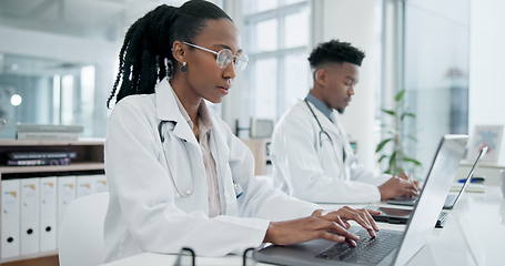 Image showing Doctor, hospital team and laptop working with research and medical data in laboratory office. Black people, professional and working for healthcare, wellness and science on a computer with info
