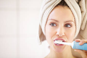 Image showing Keeping her teeth in great shape - Dental hygiene. Cropped shot of an attractive young woman brushing her teeth.