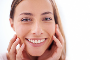 Image showing Youthful radiance. A young woman smiling at the camera - closeup.