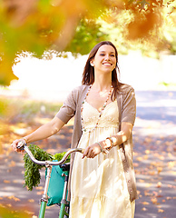 Image showing Autumn beauty. Shot of an attractive young woman in the park on an autumn day.