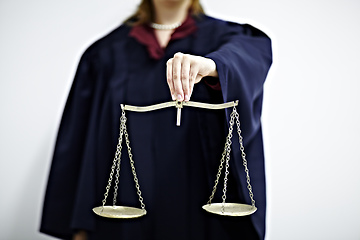 Image showing The scales of justice. Conceptual image of a judge holding a scale.