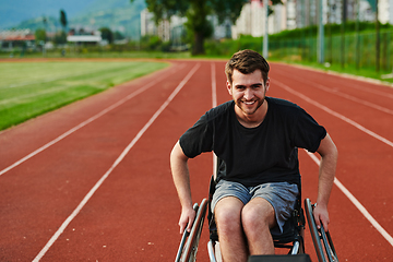 Image showing A person with disability in a wheelchair training tirelessly on the track in preparation for the Paralympic Games