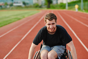 Image showing A person with disability in a wheelchair training tirelessly on the track in preparation for the Paralympic Games