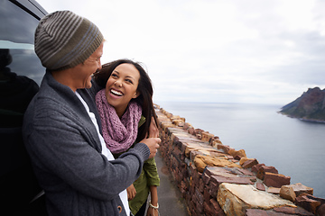 Image showing What a view. Shot of a young couple enjoying themselves on a drive.