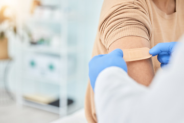 Image showing Bandaid, vaccine and arm of patient with doctor for healthcare, medical consultation and bandage for covid injection. Hands, hospital nurse and plaster for an injury, virus or safety while sick