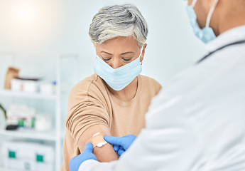 Image showing Doctor, senior patient and plaster, vaccine and wound treatment, safety and face mask for health and Covid immunity. Healthcare, injection and bandage, people at hospital and protection from virus