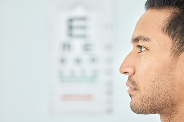 Image showing Man, face and clinic eye exam for vision, optometry and wellness for prescription lens on space. Closeup person, thinking and serious patient in optometry, ophthalmology and assessment for eyesight