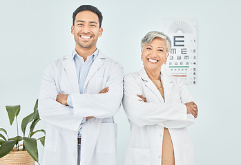 Image showing Doctors, optometry and arms crossed, portrait and eye care with vision, help and optometrist team at clinic. Wellness, health and support, collaboration and confidence with Asian man and senior woman