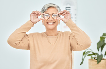 Image showing Mature woman, portrait and glasses for vision eye, test and optometry in clinic wellness, choice and prescription frames. Person, smile and Mexican patient in store, shop and eyesight retail decision