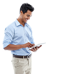 Image showing Connected to social media 247. Studio shot of a handsome young man using a digital tablet isolated on white.