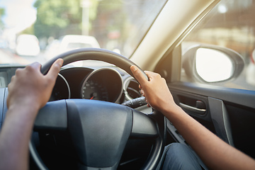 Image showing Let the journey begin. Cropped shot of a mans hands at the 10 and 2 position on a steering wheel of a car.