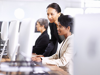 Image showing They have the best equipment for the job. Shot of three businesswomen working in an office.