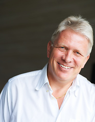 Image showing Happy and confident. Cropped portrait of a senior man against a dark background.