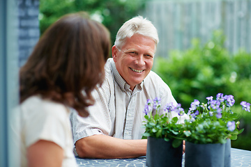 Image showing Time to relax. Cropped shot of a senior couple sitting outside.