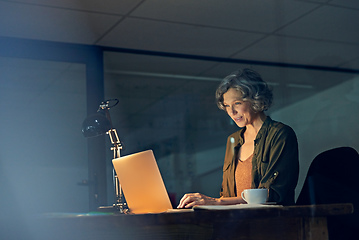 Image showing You need a tireless work ethnic to succeed. Cropped shot of a mature businesswomen working late on a laptop in an office.