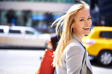 Image showing Loving city life. A portrait of a beautiful young woman in the city.