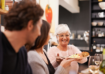 Image showing Friends and family are the true gifts in life. Shot of a family sitting down to dinner.