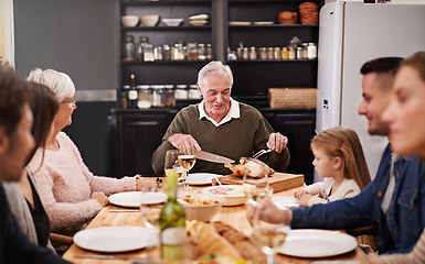 Image showing They always get together on special occasions. Cropped shot of a family sitting down to dinner.