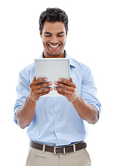 Image showing Connected to social media 247. Studio shot of a handsome young man using a digital tablet isolated on white.