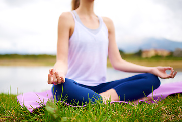 Image showing Life is a balance of holding on and letting go. Shot of a young woman doing yoga outdoors.