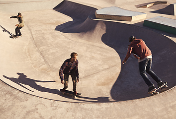 Image showing Their second home. Young men skating at a skate park.