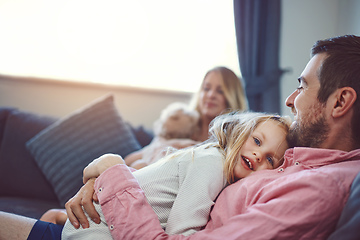 Image showing Love them, nurture them, care for them. Shot of an adorable young family of four relaxing together on the sofa at home.