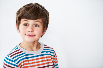 Image showing Stop staring now. Shot of a cute little boy looking at the camera.