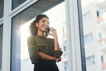 Image showing Exciting prospects on the horizon. Shot of a young businesswoman making a phone call in her office.