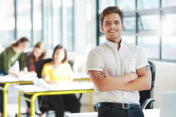 Image showing Confidence is easy with these guys behind me. Cropped portrait of a businessman in an office with his colleagues in the background.